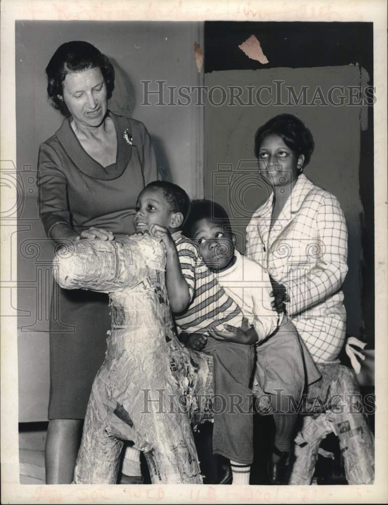 1969 Ladies pose with kids on hobby horse in New York-Historic Images