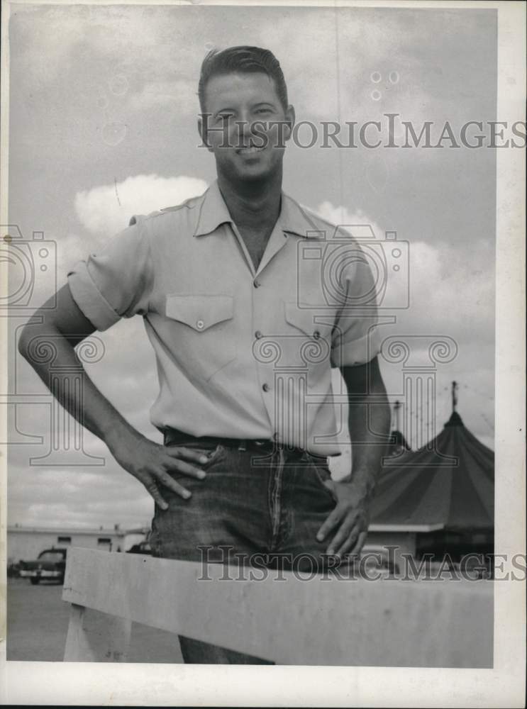 1958 Jack Haskell stands near tents-Historic Images