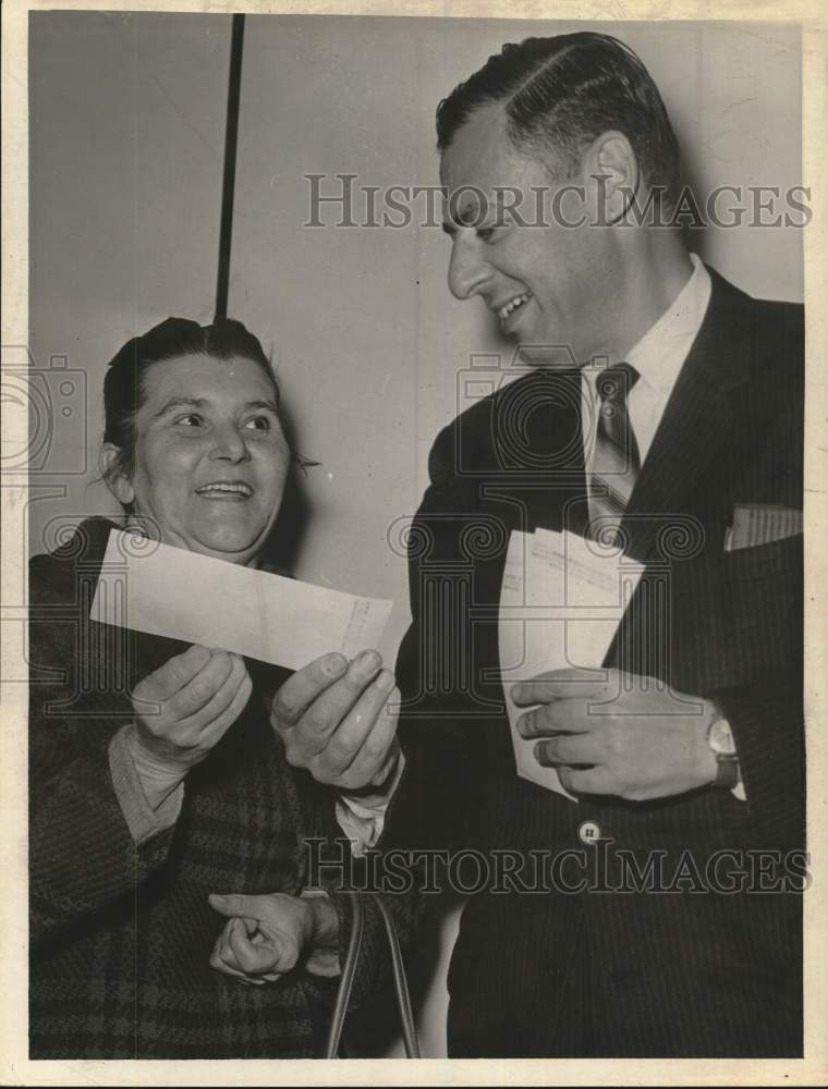 1967 Regina Surin receives check from Robert Herman in New York-Historic Images