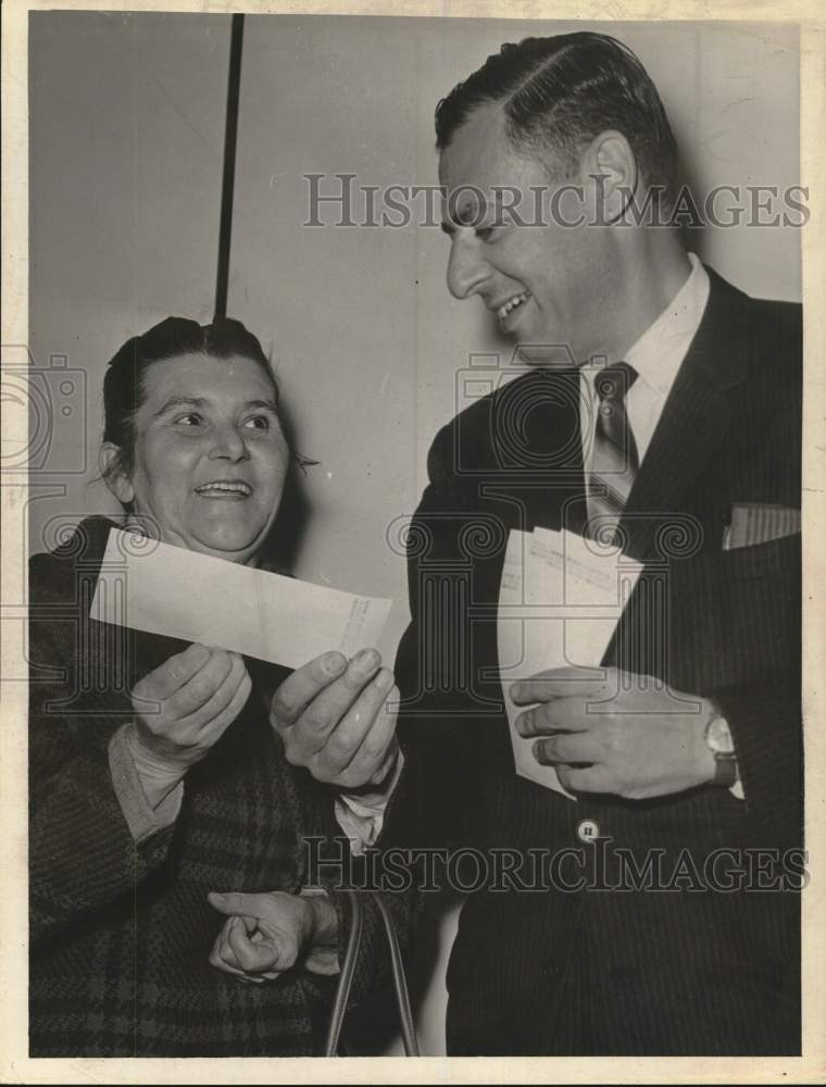 1967 Regina Surin receives check from Robert Herman in New York-Historic Images