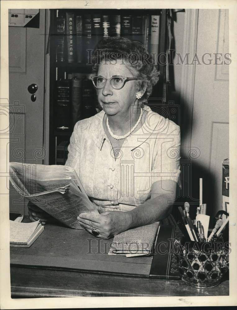 1963 Elizabeth O. Fisk reading newspaper in Albany, New York-Historic Images