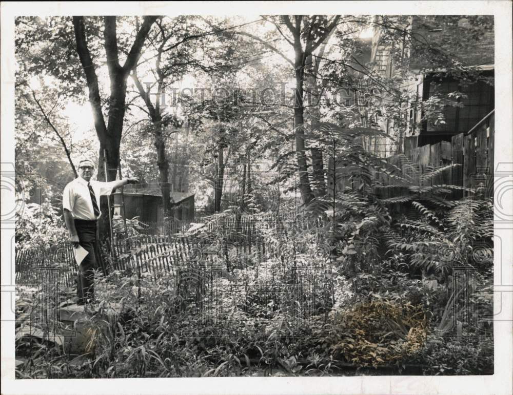 1969 Press Photo Albert Hartheimer at Overgrown Residential Lawn - tub33314 - Historic Images