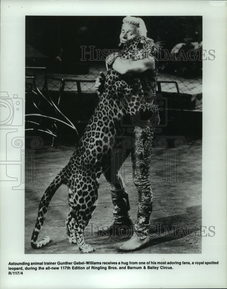 Press Photo Ringling Brothers animal trainer receives hug from leopard - Historic Images