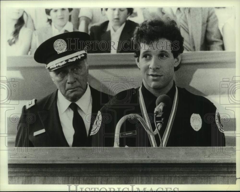 1987 Press Photo Steve Guttenberg &amp; George Gaynes star in &quot;Police Academy&quot; - Historic Images