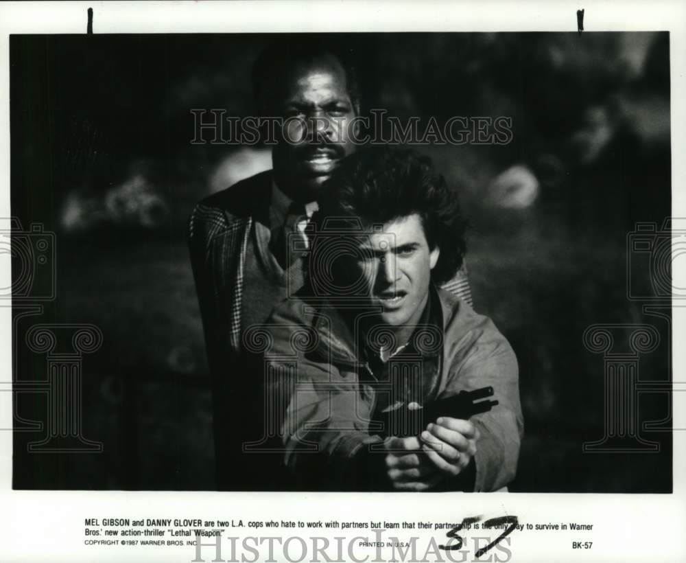 1987 Mel Gibson and Danny Glover costar in &quot;Lethal Weapon&quot; - Historic Images