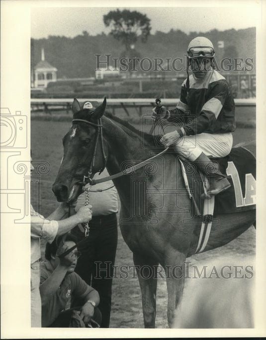 Press Photo Jockey Jean Crugret sits atop a horse with
