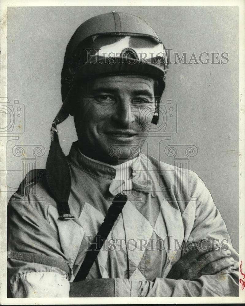 Press Photo Jockey Jean Crugret smiles for the camera in his riding attire- Historic Images