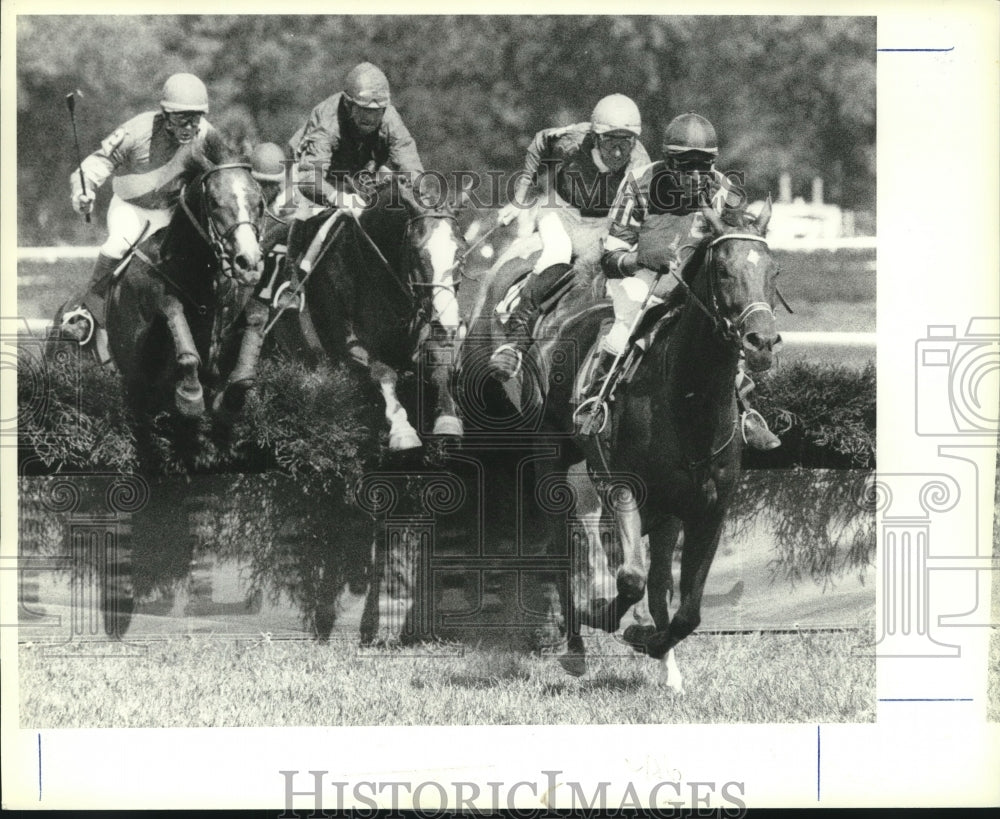 1980 Press Photo A group of jockeys navigate horses during Steeplechase event - Historic Images