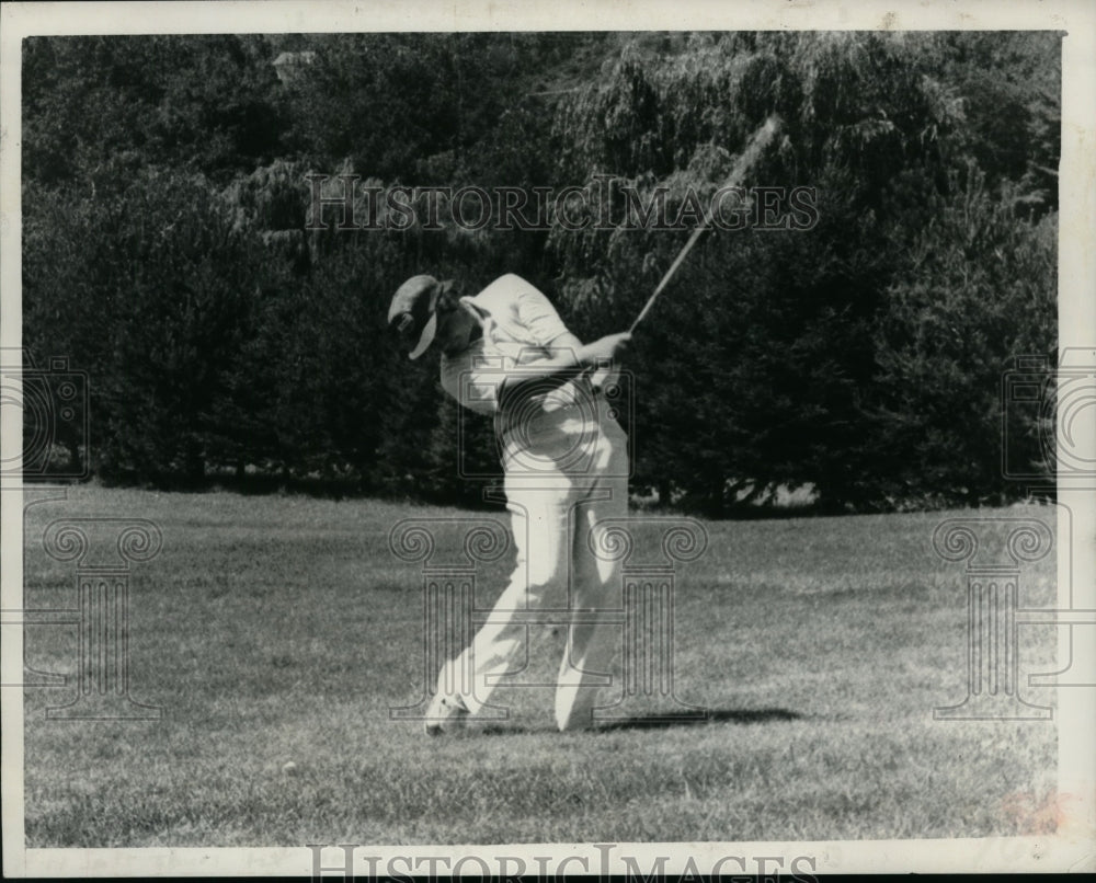 Golfer Jeff Lauretti takes practice swing during round in New York - Historic Images