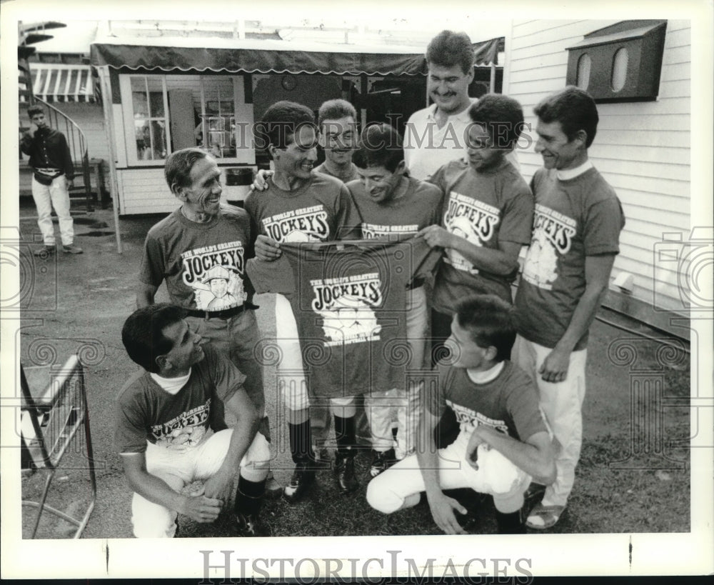 1990 Press Photo Jockeys pose with t-shirts at Saratoga Raceway, New York- Historic Images
