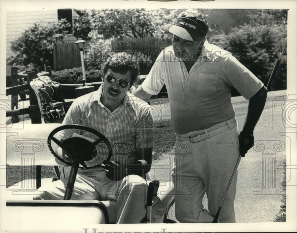 1984 Press Photo Golfers look over score card during round in New York - Historic Images