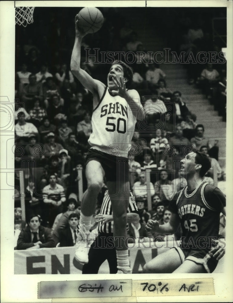 1987 Press Photo Shenedehowa #50 drives to the basket against CBA player #45 - Historic Images