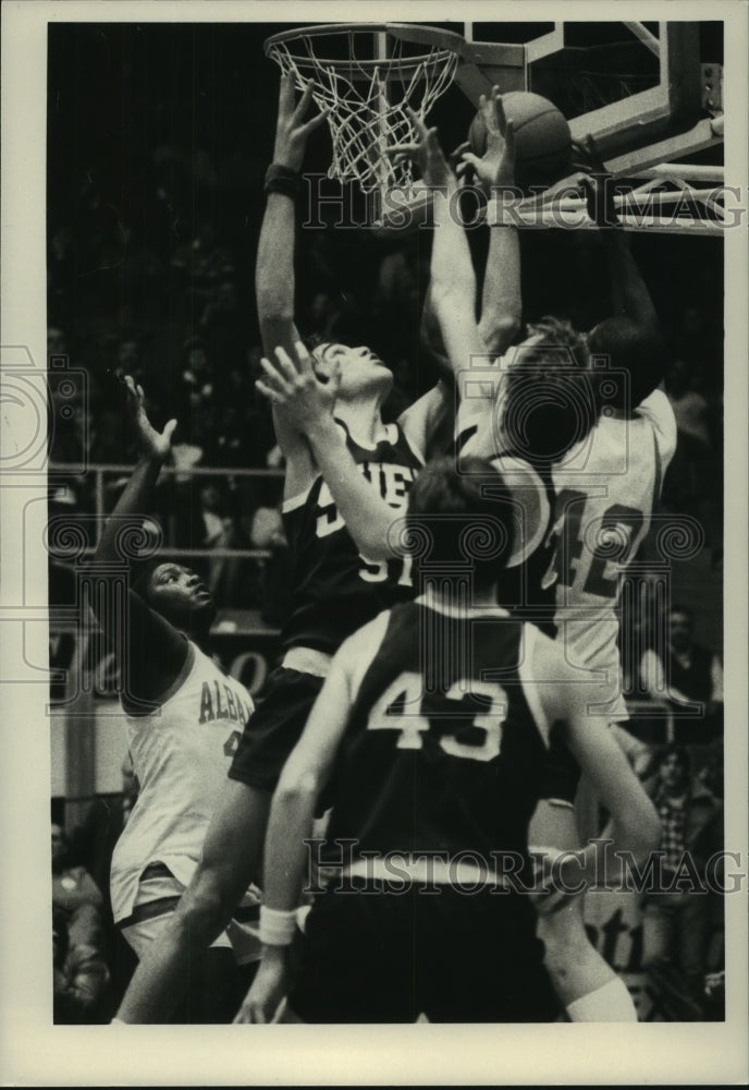 Shenedehowa #51 Kubeck battles against Albany players in basketball - Historic Images