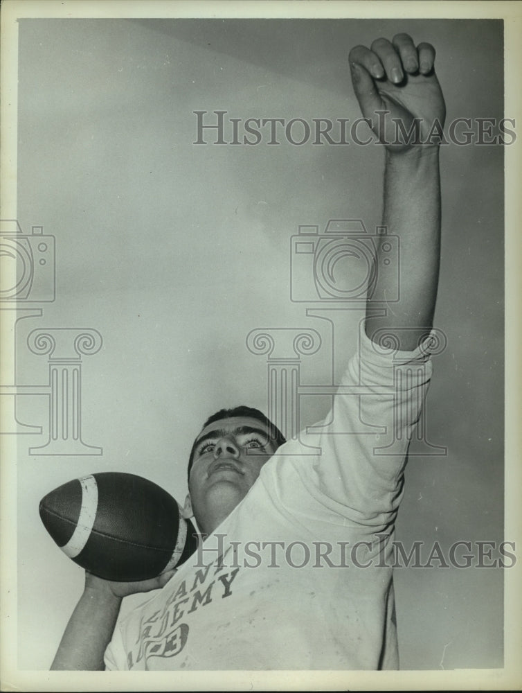 1962 Albany Academy football player Neil Murray ready to throw ball - Historic Images