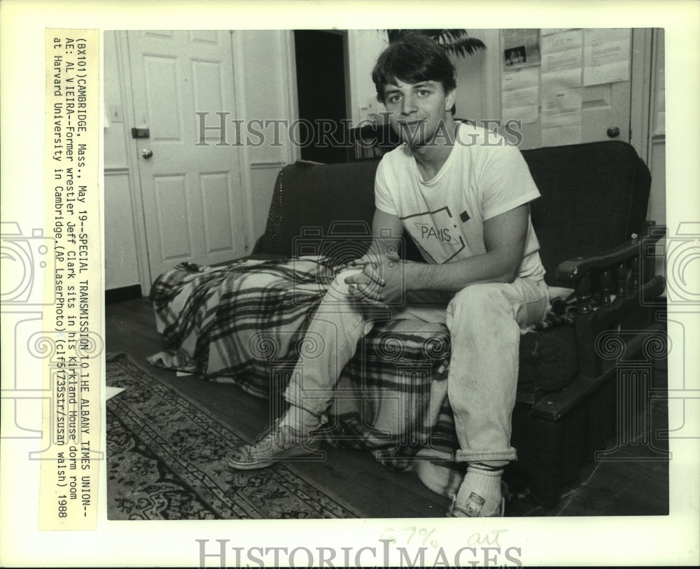 1988 Press Photo Former wrestler Jeff Clark sits in his Kirkland House dorm room- Historic Images