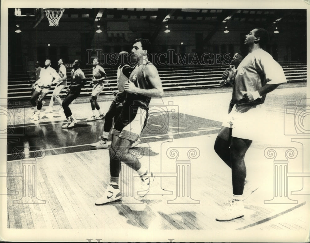 1988 Press Photo Albany Patriots basketball players run sprints during practice- Historic Images