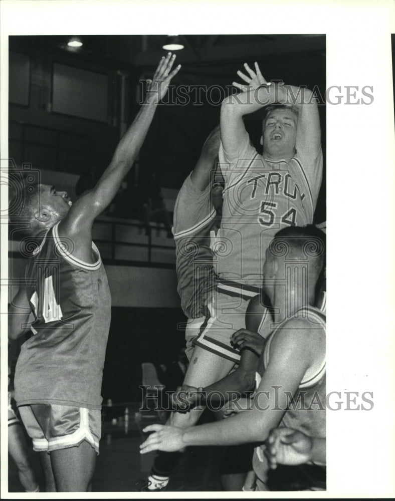 Press Photo Troy basketball player #54 Justin Gardner gets ball stripped out - Historic Images