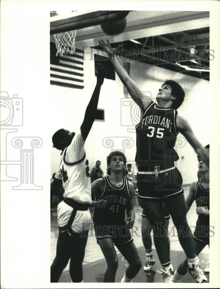 Press Photo Waterford basketball player #35 gets rebound over AA&#39;s Rob Rogers - Historic Images
