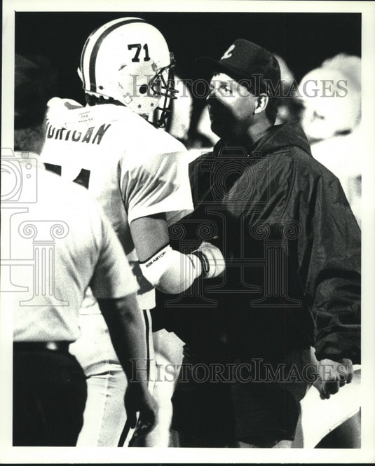 Lansingburgh football coach John Diehl talks with his player