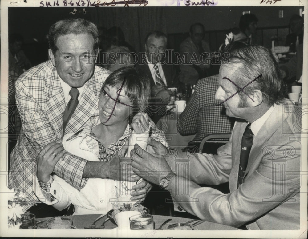 Gentleman hugs associate at luncheon in New York - Historic Images