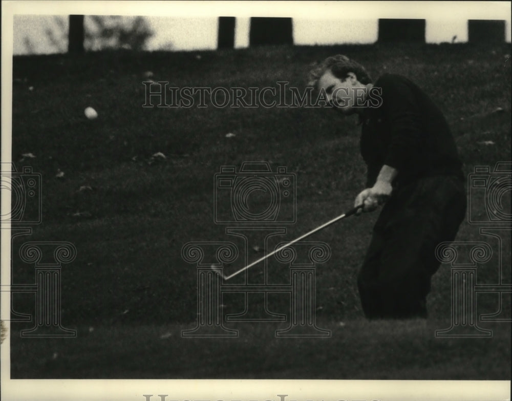 Robert Bigley takes swing during round of golf in Albany, New York - Historic Images