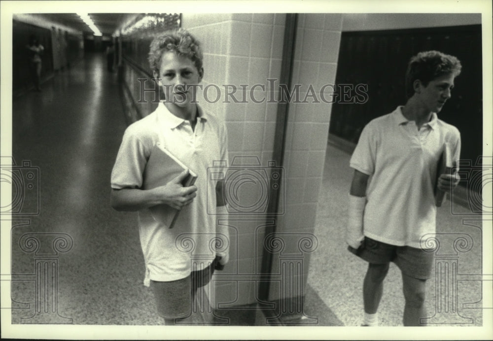 1989 Press Photo Frank Fronhofer walks in hall at Salem Central School, New York- Historic Images