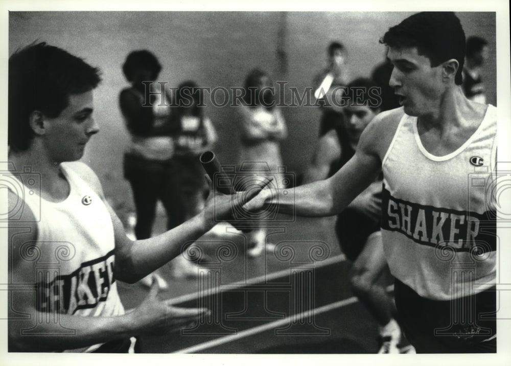 1990 Press Photo Relay team passes baton during race at track meet in Troy, NY- Historic Images