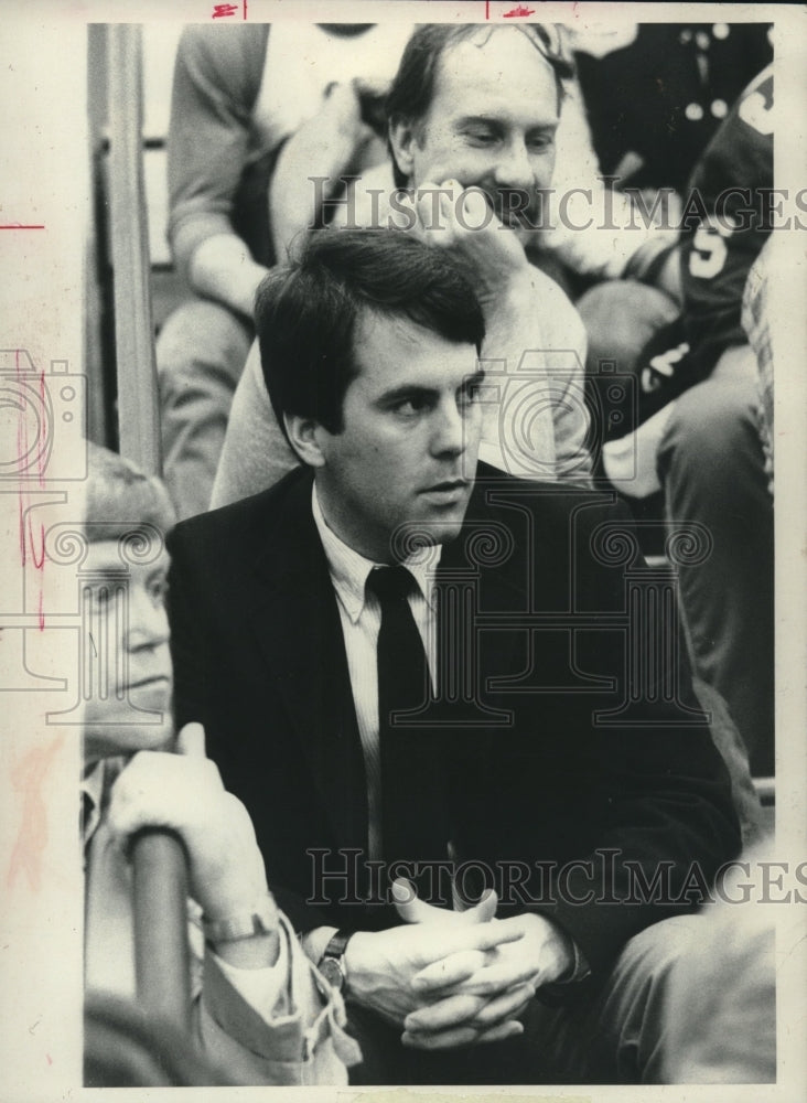 Press Photo Basketball John Griffin sits in stands during game - tus04201 - Historic Images