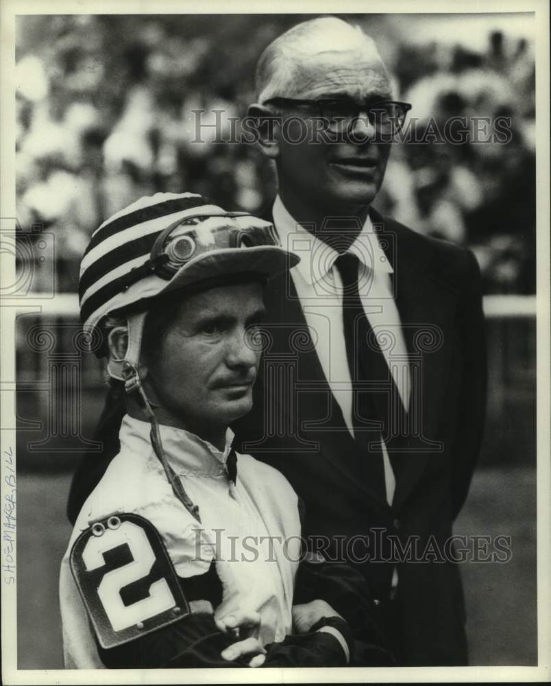 Press Photo Jockey Bill Shoemaker stands with another unidentified man - Historic Images