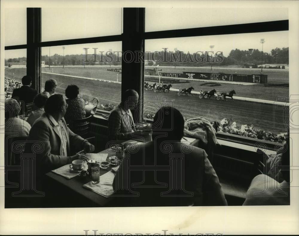 Press Photo Fans watch race from clubhouse at Saratoga Raceway, New York - Historic Images