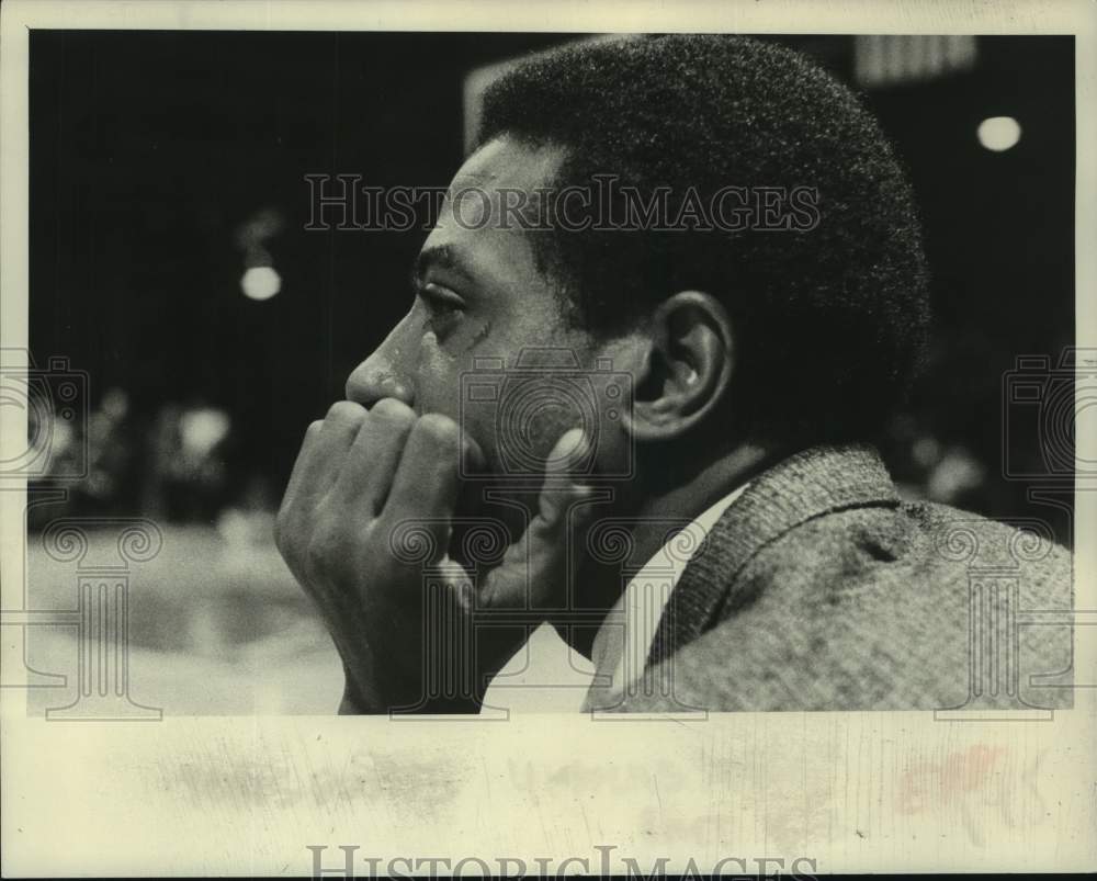 Basketball player and coach Dean Meminger looks on during game - Historic Images